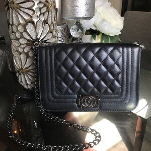 Designer look black quilted handbag with chain strap.